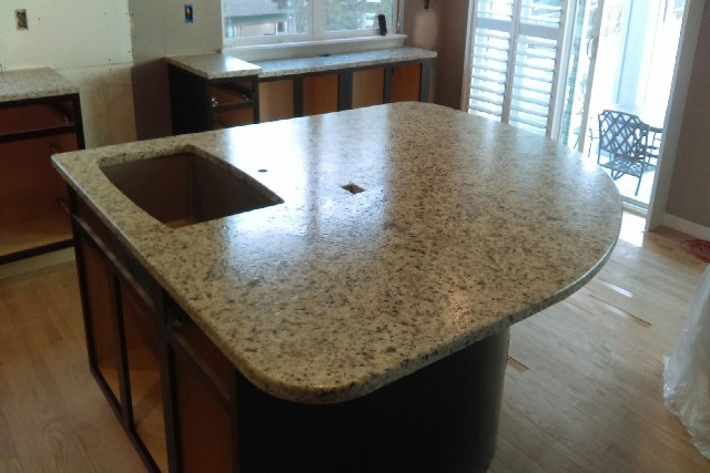 Bianco santa cecilia granite with leathered finish and double radius edges 597